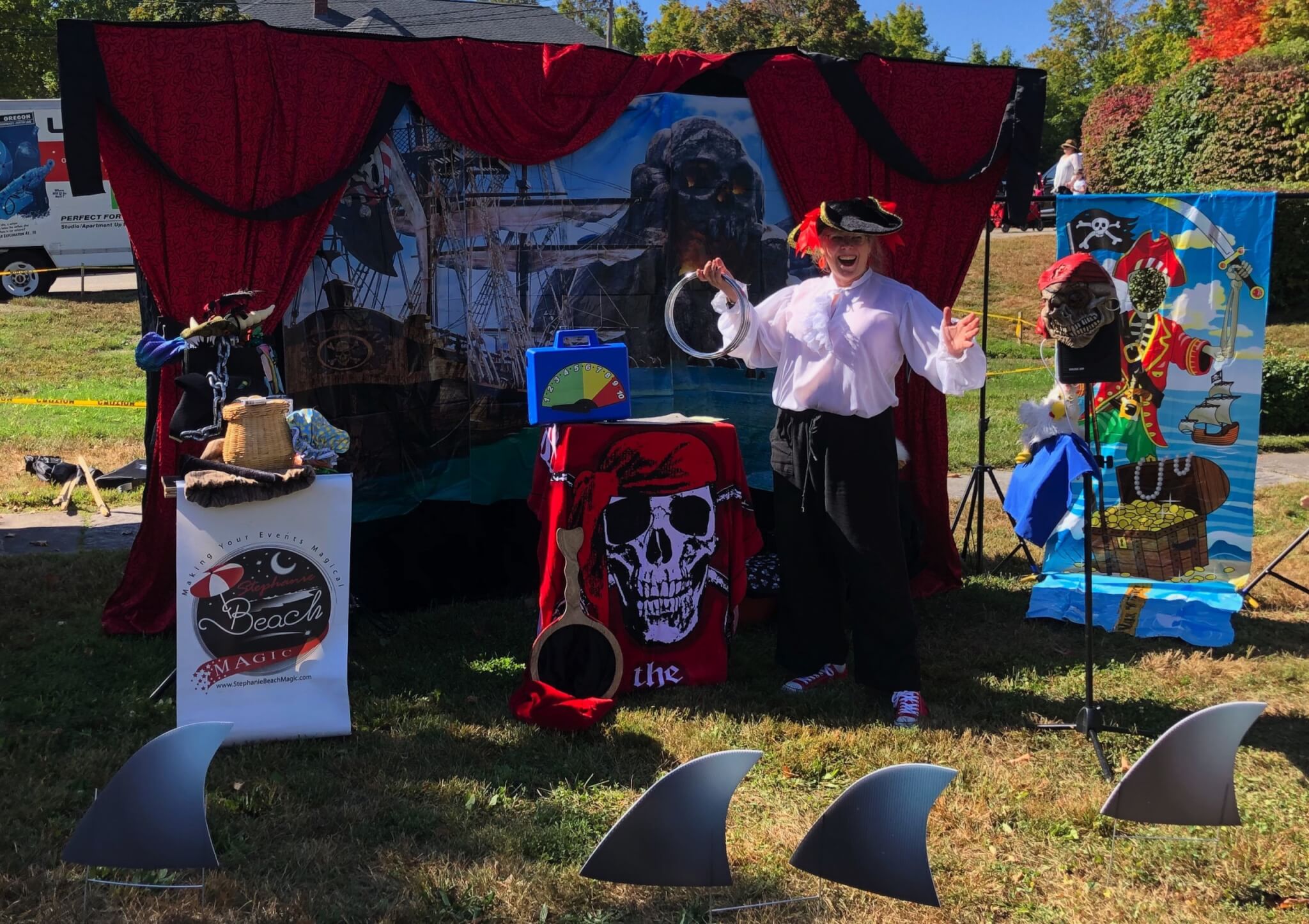 Magician Stephanie Beach performing magic as a pirate during a local festival.